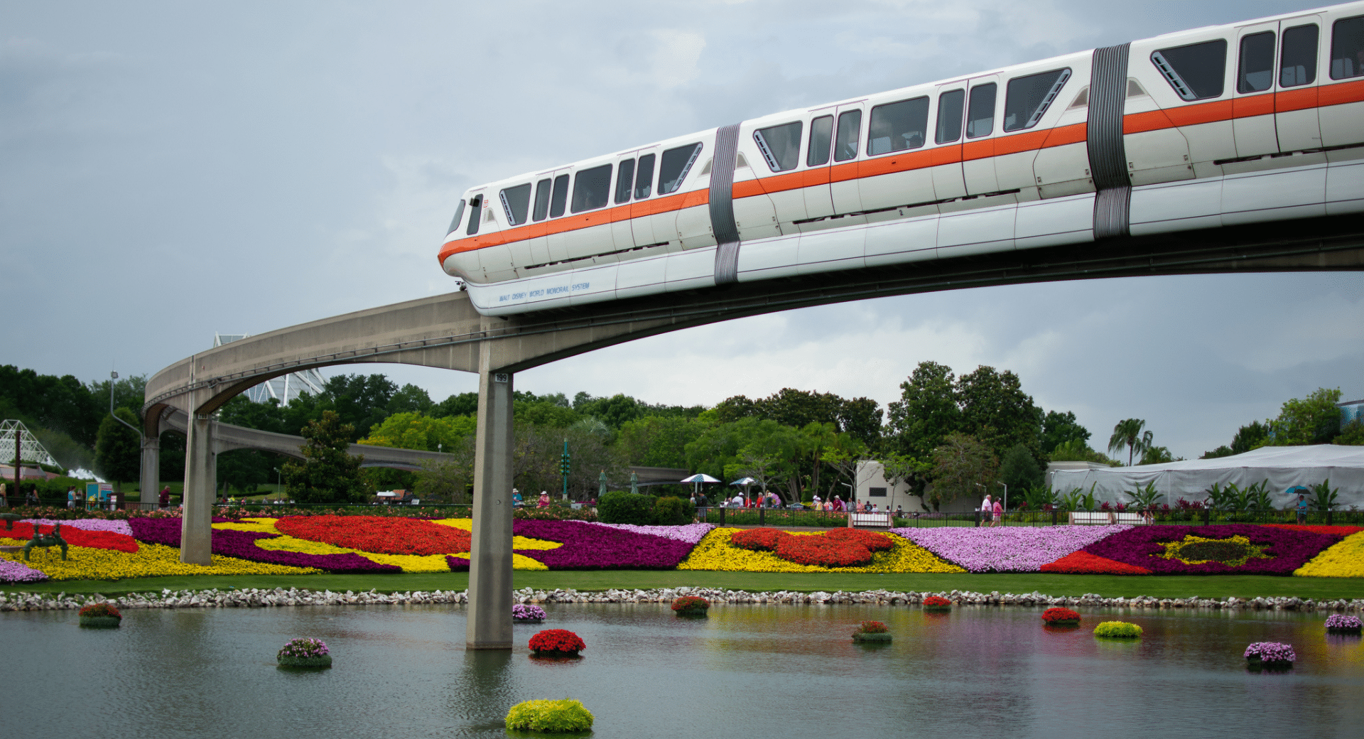 Monorail Orange going through Epcot's Flower and Garden Festival