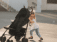 Young child pushing a stroller in New Orleans