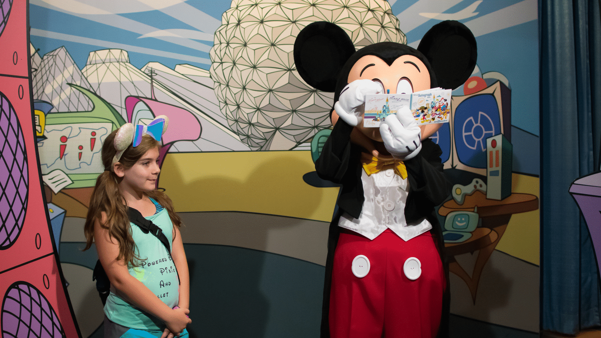 Mickey Mouse signing autographs at Epcot