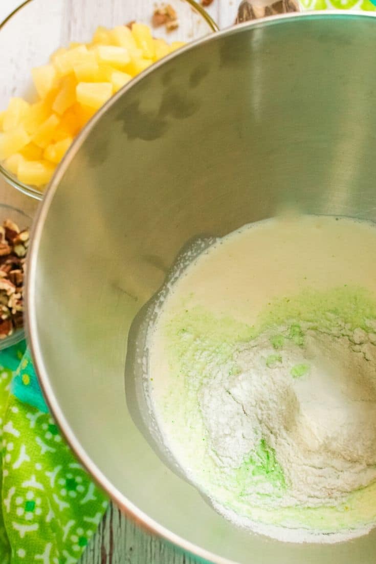 mixing the heavy whipping cream and pudding for Watergate Salad
